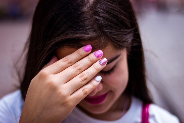 Shy girl hiding her face