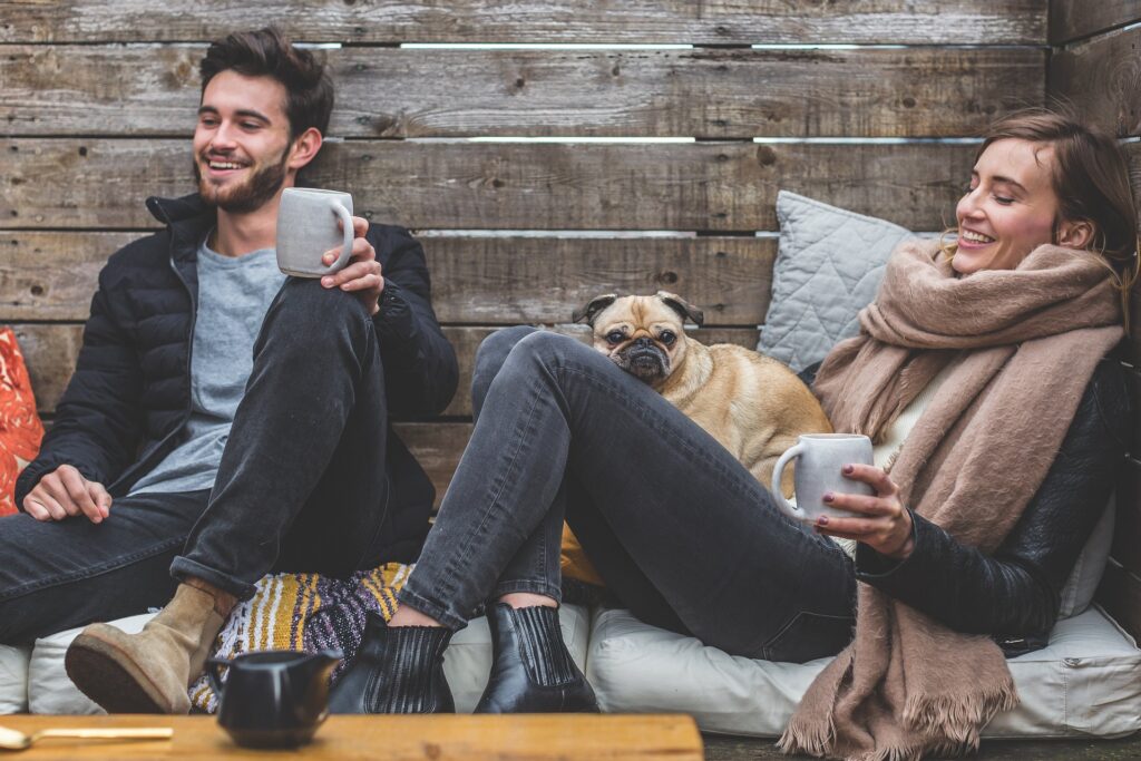 Family enjoying evening with pet dog