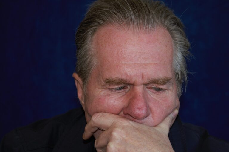 Man covering mouth