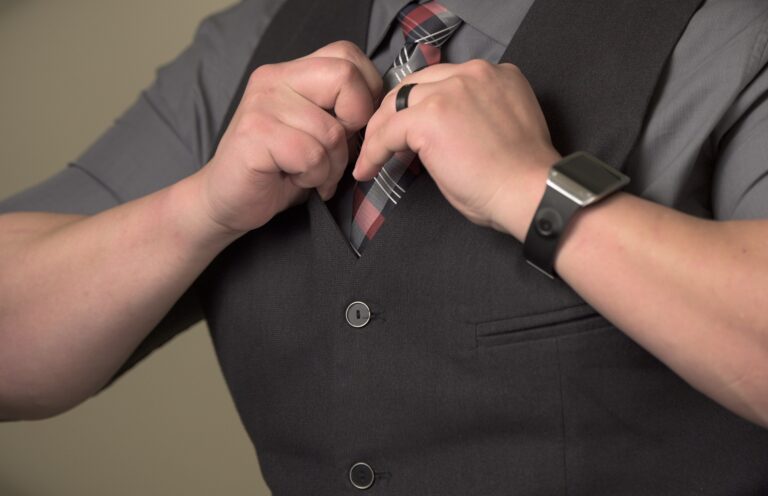 Man adjusting business attire