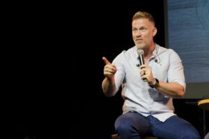 Man giving presentation in a public stage