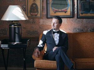 Man, in an antique looking room