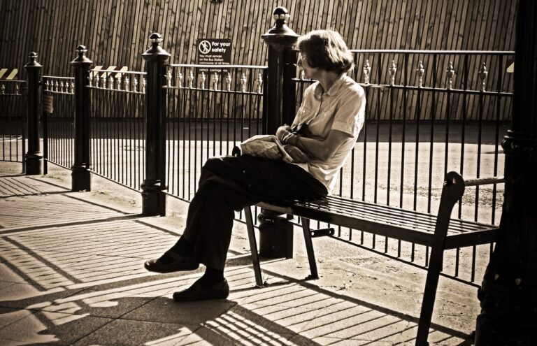 Woman, waiting on bench