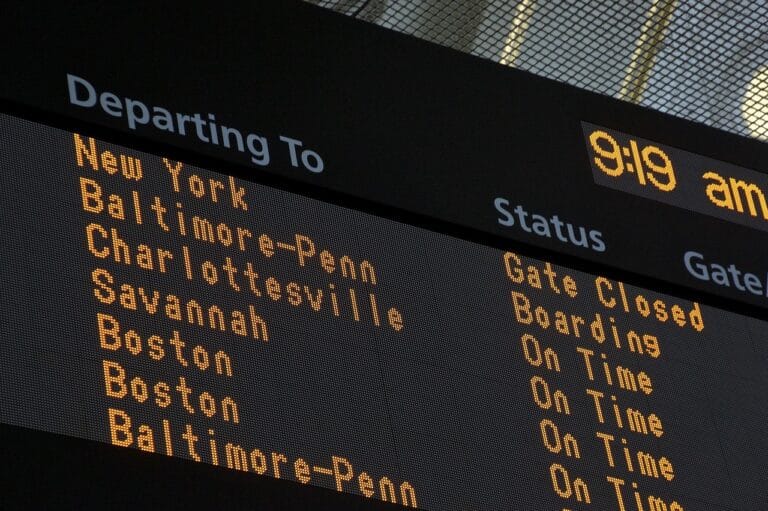 Airport sign showing departure times